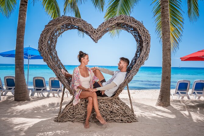 Cozumel: KUZÁ Beach Day, Buffet, Open Bar & Mexican Flavors Class - Beach time with performances, games, and calm-water swimming